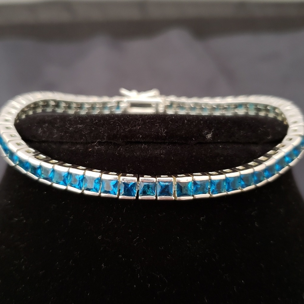 Sterling silver Blue Topaz tennis bracelet.